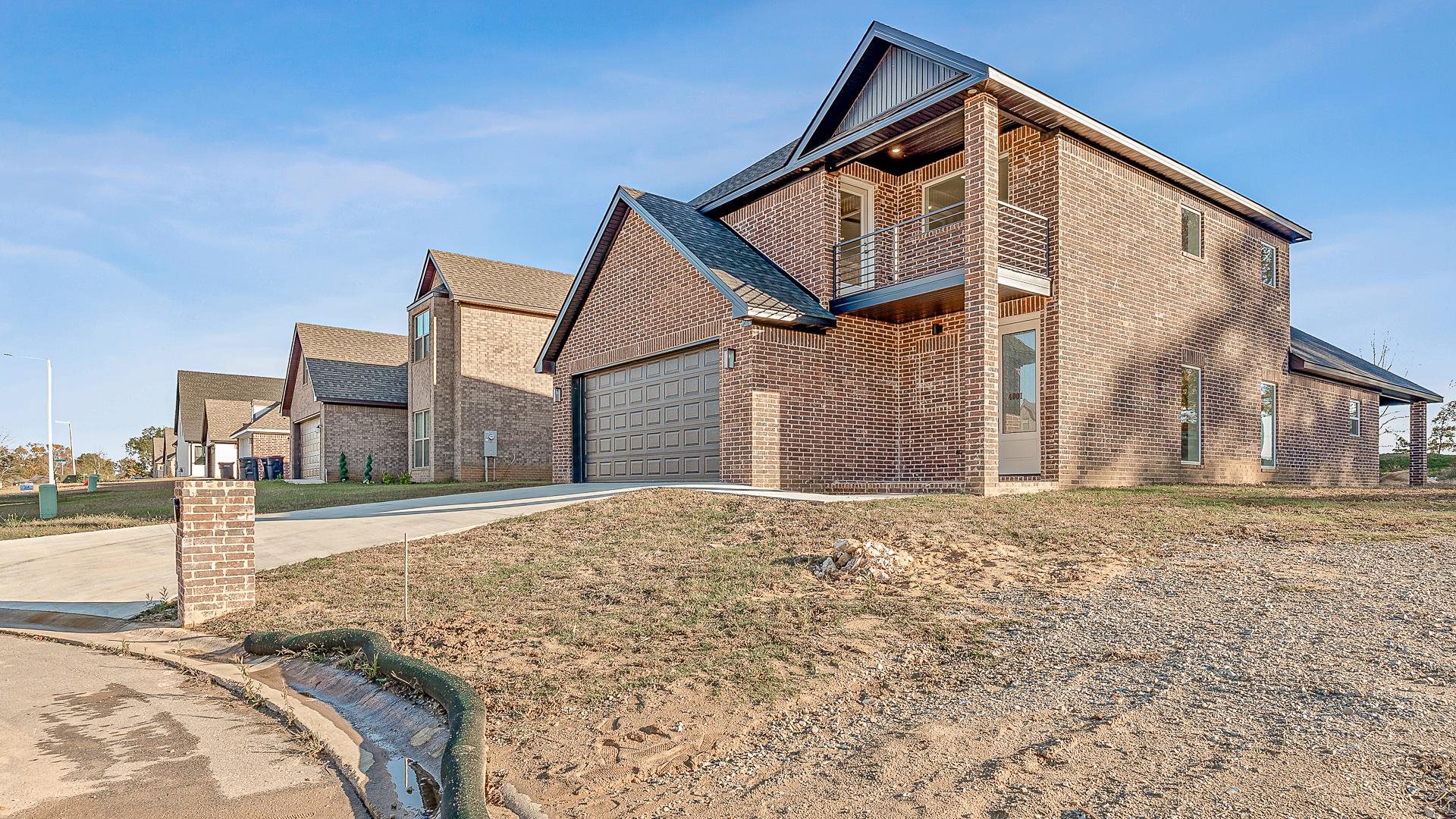 Modern Elegance at 4001 Stoke, Jonesboro, AR! Step into this stunning new construction home featuring soaring 20 ft ceilings and expansive windows that flood the space with natural light. Boasting 2,300 sq ft, this 4-bedroom, 3-bathroom brick home offers luxury living at its finest. The open-concept design highlights premium carpet upstairs and luxury vinyl plank flooring throughout the main level, combining comfort and durability. The chef’s dream kitchen features granite countertops and ample cabinet space, while the bathrooms echo the same elegance with granite finishes. The oversized master suite is a true retreat, complete with a walk-in closet featuring built-in shelving and a spa-like bathroom with a tiled shower and a separate soaking tub. Enjoy the view from the second-floor balcony or relax in the serene neighborhood near Arkansas State University and NEA Baptist Hospital.