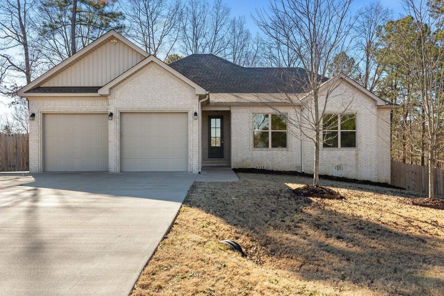 Wonderful home in Pinewood Estates. Located on 1.39 wooded acres, you'll find 3 BR 2BA with new flooring & paint. The living room is open to the kitchen & breakfast area. The large room off the living area has multi-use potential as office, formal dining, or kid's room that you can easily watch from kitchen. Primary BR  connects to the covered deck. Primary ensuite has soaking tub, separate shower, large walk-in closet. Secondary bedrooms have excellent storage options in closet. Your furry friends will love the  shower/grooming station in the garage. Storage space located under home. ATT or First Co-op fiber options for high speed internet on those work from home days. Bryant Schools. 20 min. to west Little Rock shopping. Agents see remarks.