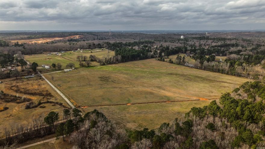 Rare opportunity to own an established working horse and cattle ranch on nearly 80 acres just minutes from Little Rock. This versatile property offers excellent potential for income production, livestock operations, or future development. The property currently features 7 double-wide mobile homes and 1 single-wide mobile home, generating approximately $6,000 per month in rental income with units currently occupied. Mobile homes may remain with the property or be removed prior to closing, providing flexibility for investors or developers. Equipped for livestock operations, the ranch includes well-designed horse barn featuring multiple stalls, tack room, hot water wash station, automatic lighting, and a built-in fly spray system. Two additional stall areas can easily be enclosed for added capacity, while three stalls maintain dirt flooring ideal for certain livestock needs. Additional ranch improvements include multiple storage buildings, a lighted corral, and an RV hookup, making the property functional for day-to-day ranch operations or additional income opportunities. This property offers tremendous possibilities for continued ranching, rental investment, or future development.
