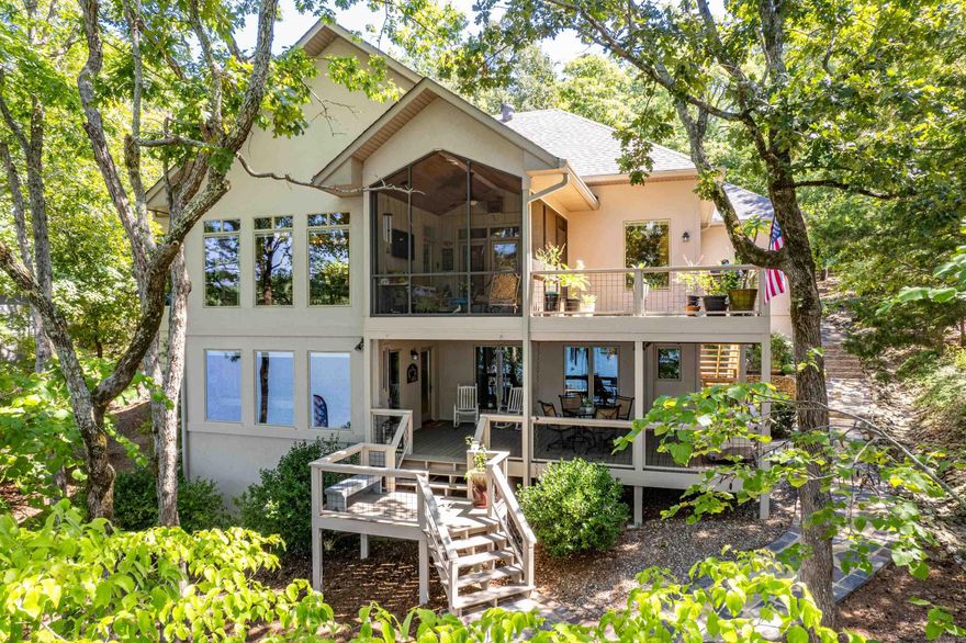 Lake Balboa Retreat welcomes you with warmth and luxury! From front entrance cypress posts to the stone patio lakeside, you'll find refreshing details of quality and elegance! This home has every space upgraded inside and out! The entrance boasts board and batten siding, garage and window "sheds," stone accents, and a vaulted porch with 12x12 posts. The glass double doors with transom window allows an immediate glimpse of the lake! The living room's built in shelving and corner windows maximize view potential! An open floor plan allows for a kitchen of abundant custom cabinets and plentiful counter top/ island space! The views of the lake are stunning from the breakfast room with a wall of windows! You'll find the main bedroom's access to the screened porch to be a bonus! The totally renovated bathroom and laundry rooms are well-appointed and magazine worthy! On the lower level you'll find a spacious game room with custom bar, three bedrooms and two full baths! Don't miss the heated and cooled storage room with outside access not included in the sq ft! Call or text for a full feature list of home modifications made since 2017! Private tours can be scheduled!