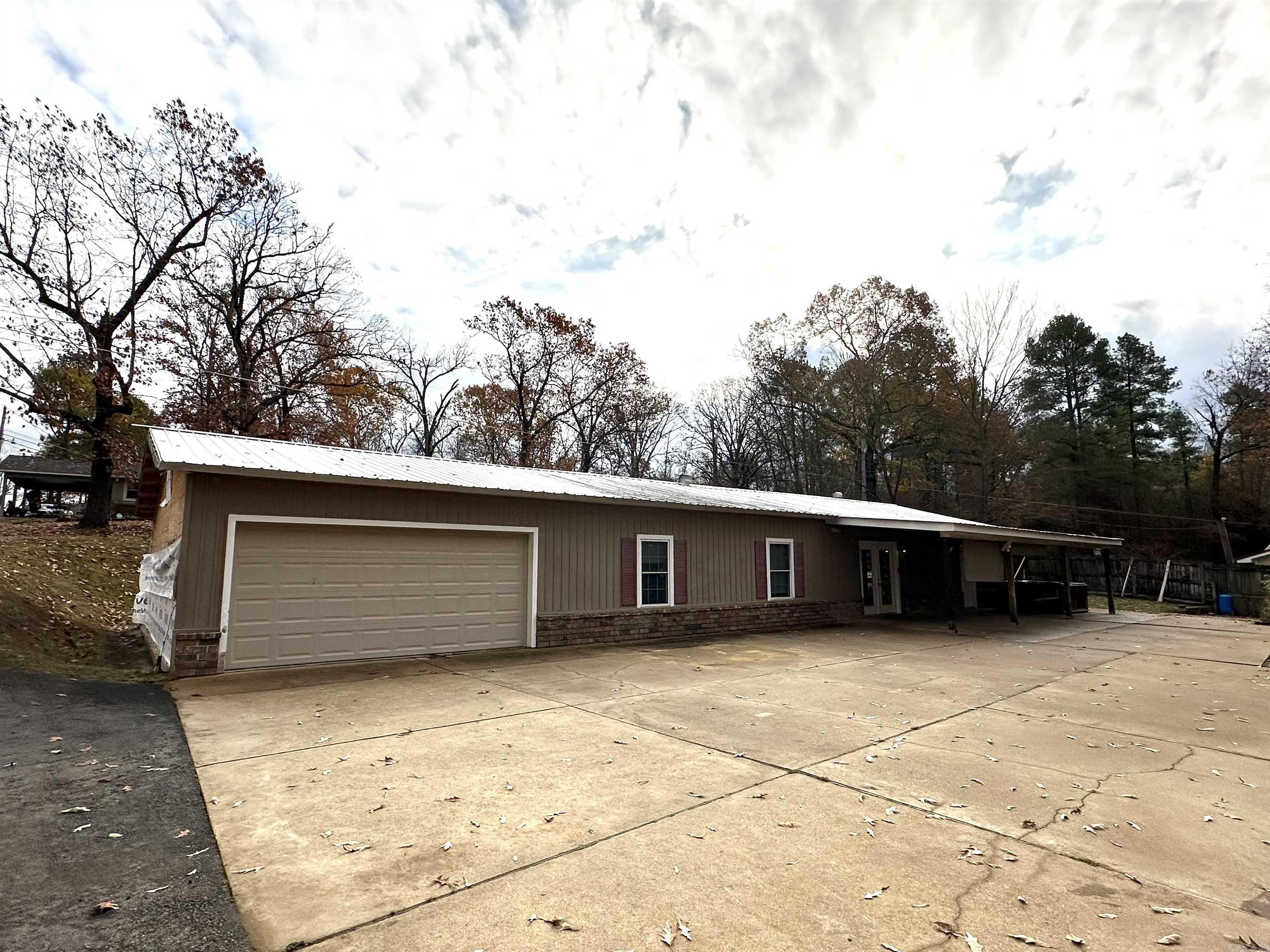 3 or 4 bedroom home on Lake Catherine with one stall wooden boat dock with permit. Garden spots, dog run, covered patio, garage, and great neighbors makes this spot a winner. New asphalt driveway. Bring your decorating ideas to this blank pallet. Open easy flow floorplan.