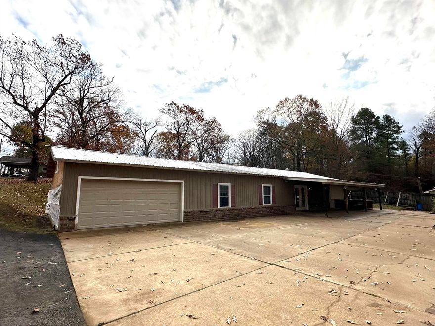 3 or 4 bedroom home on Lake Catherine with one stall wooden boat dock with permit. Garden spots, dog run, covered patio, garage, and great neighbors makes this spot a winner. New asphalt driveway. Bring your decorating ideas to this blank pallet. Open easy flow floorplan.