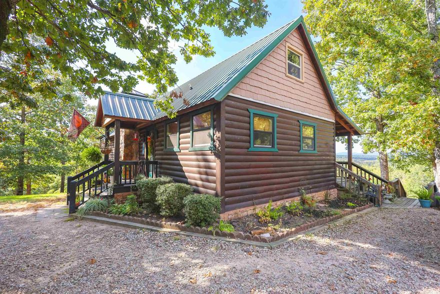 MOTIVATED SELLERS! Mountain views, multiple cabins, and endless possibilities! Tucked away on 11.39± secluded acres that adjoin Corp Land, this unique property offers the perfect blend of serenity and opportunity. The main cabin has been beautifully renovated from top to bottom, featuring 2 bedrooms, 1.5 baths, and stunning craftsmanship throughout. Just steps away, a second cabin awaits—ideal for guests, a mother-in-law suite, or even short-term rental income—with its own kitchen, bath, and additional bedrooms. Two smaller cabins are also scattered across the property and are being sold as-is—ready for a creative touch or future use. A 30x30 building on the property adds plenty of room for storage, hobbies, or workspace. Outdoor living shines here with a covered entertaining area, fire pit, and safe room under the home, all designed to take advantage of the tranquil setting. You’ll also find five RV hookups (30/50 amp) and a new water filtration system for the well. Whether you’re relaxing on the porch soaking in the sunsets, exploring direct access through the Corp to nearby Bear Creek ATV trails and Lake Greeson to spend your day this one offers it all!
