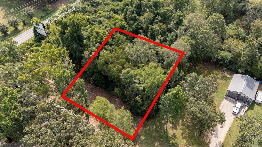 Great lot with a great layout.  This parcel is conveniently located off of Springhill Road and just outside of the Bryant City limits.  The property is unrestricted and mobile homes are allowed!  Easy to access and utilities are at the road.  Call for an appointment to see the property.  *Agents See Remarks*