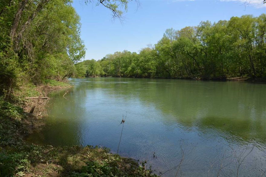 79.5  acres with 1007 feet of riverfront frontage, dock available, property has large private stocked lake with dock, Also has 1022 sf Cabin updated in 1996, wood stove, and CH&A,  Opportunities to buy acreage on the river are few and far between especially in this location. Have it all, hunt and fish on the  lake or your private part of the river.  Mineral rights do not convey at this price but could be bought separately