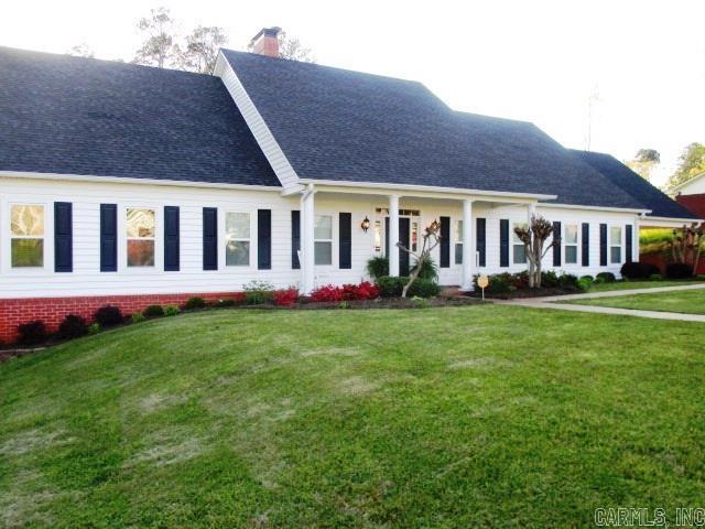 Step into comfort & style w/ this beautifully maintained 3BR, 2BA traditional 2-story home. From the inviting front porch to the spacious covered patio, this home is designed for both relaxed living & effortless entertaining. Inside, you’ll find vaulted ceilings, hardwood floors, & two generous living areas—including a cozy den w/ a gas log fireplace. The separate dining room features elegant built-in cabinetry, perfect for gatherings/everyday meals. The heart of the home is the custom-built gourmet kitchen, complete w/ a large kitchen island, granite countertops, a full side-by-side refrigerator/freezer, & a high-end range—ideal for home chefs & entertaining. All three bedrooms are conveniently located on the main level, including a spacious primary suite with an ensuite bathroom & 2 walk-in closets. Upstairs, a large bonus room provides endless flexibility for an office, playroom, media space, or guest suite. Enjoy outdoor living on the covered patio overlooking the backyard—great for barbecues, morning coffee, or quiet evenings. Additional features include an attached double garage w/ a dedicated storage room, providing plenty of space for tools, equipment, or seasonal items.