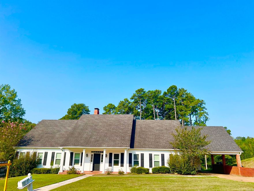 Step into comfort & style w/ this beautifully maintained 3BR, 2BA traditional 2-story home. From the inviting front porch to the spacious covered patio, this home is designed for both relaxed living & effortless entertaining. Inside, you’ll find vaulted ceilings, hardwood floors, & two generous living areas—including a cozy den w/ a gas log fireplace. The separate dining room features elegant built-in cabinetry, perfect for gatherings/everyday meals. The heart of the home is the custom-built gourmet kitchen, complete w/ a large kitchen island, granite countertops, a full side-by-side refrigerator/freezer, & a high-end range—ideal for home chefs & entertaining. All three bedrooms are conveniently located on the main level, including a spacious primary suite with an ensuite bathroom & 2 walk-in closets. Upstairs, a large bonus room provides endless flexibility for an office, playroom, media space, or guest suite. Enjoy outdoor living on the covered patio overlooking the backyard—great for barbecues, morning coffee, or quiet evenings. Additional features include an attached double garage w/ a dedicated storage room, providing plenty of space for tools, equipment, or seasonal items.