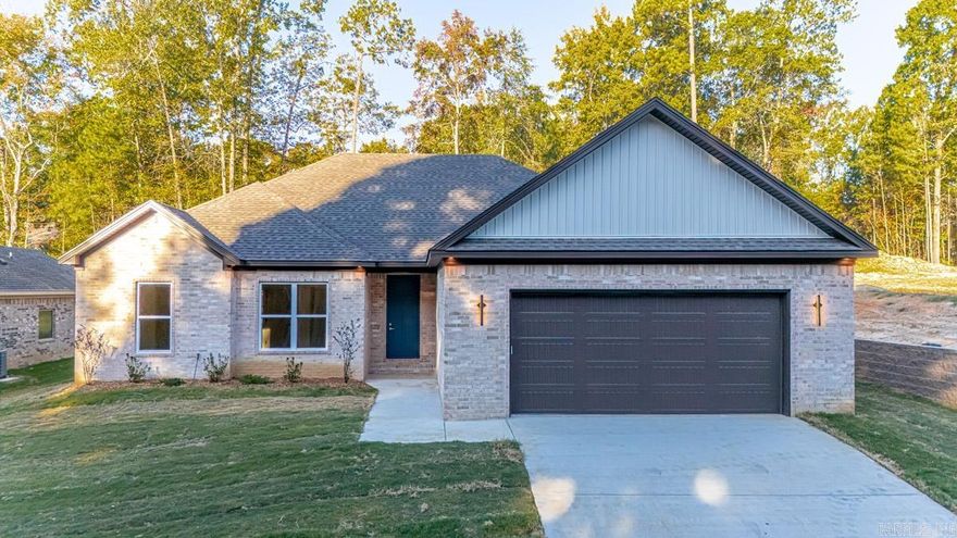 Step inside this beautiful new 4-bedroom, 2-bath home and fall in love with its thoughtful design and modern charm. From the moment you walk through the front door, you’re greeted by a bright, open living space centered around a striking brick fireplace. The kitchen is a true showpiece, featuring leathered granite countertops, custom cabinetry, stainless steel appliances, and a generous pantry for added convenience. The open floor plan makes everyday living and entertaining effortless, while luxury vinyl plank flooring flows throughout the main areas and bedrooms, complemented by tile in the baths and laundry. The spacious primary suite offers a private retreat with a walk-in closet and a beautifully designed ensuite complete with dual sinks, a tiled shower & soaker tub. Quality finishes, timeless style, and a comfortable layout come together perfectly in this new construction home — ready for you to make it your own.