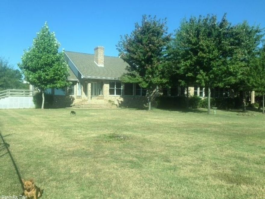 Custom built house by previous owners (only 2 owners) 9' ceilings throughout, ceramic tile flooring, 2 thermal h/ac units, Pella windows , large rooms, large open living areas, gourmet kitchen with 5 burner gas cooktop, new double ovens, full sized Sub Zero Freezer and Refrigerator (each separate), extra large closets and pantrys, built in bookshelves in greatroom, large 40X60 metal shop building with electricity, concrete floor, completed office (w/central h/ac), and roof overhang . place for mobile home.