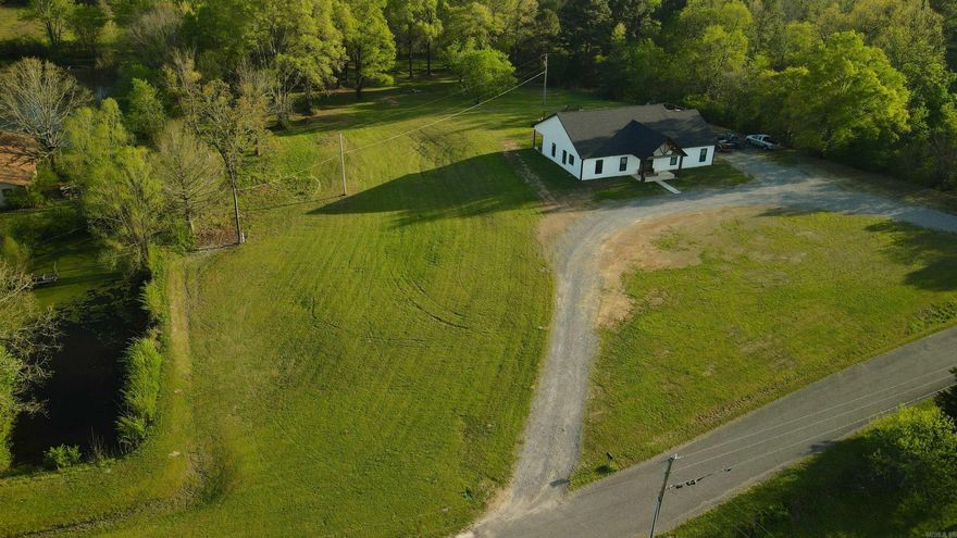Nestled in the serene countryside, this beautifully designed 4-bedroom modern home offers the perfect blend of luxury, quiet, and comfort. Step inside to discover a spacious open-concept layout with sleek finishes and an abundance of natural light. The heart of the home features a cozy stone fireplace, creating an inviting atmosphere in the living room for those cool evenings. The gorgeous custom kitchen island provides ample space for family gatherings and the kitchen cabinets/walls recently had a beautiful backsplash installed. Appliances are top of the line! A generous flooring allowance is also being offered to the lucky buyer that acts first and desires even more than the lovely stained concrete throughout! The walk-in pantry is an absolute thing of beauty (and generous storage!). Each bedroom provides the perfect space, with new built-ins added to the large closets. The beautifully-designed bathroom showers offer a touch of elegance and personality while inviting you sit and stay a while! The thoughtfully designed laundry-mudroom combo serves as a practical side entryway, exactly what's needed for keeping outdoor gear organized and out of sight. Enjoy low utility bills thanks