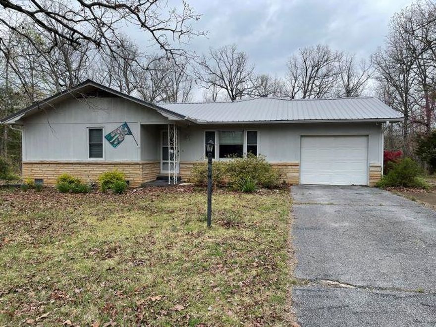 Well maintained 2 bed/2 bath home within golf cart distance to Turkey Mountain Golf Course. There have been many new updates in the last four years including: new metal roof, appliances that will remain including washer and dryer, kitchen countertops, carpet, garbage disposal, HVAC, and a deck on the backside of the house. The fireplace has been capped-the buyer could install gas logs. This property has city sewer and water.