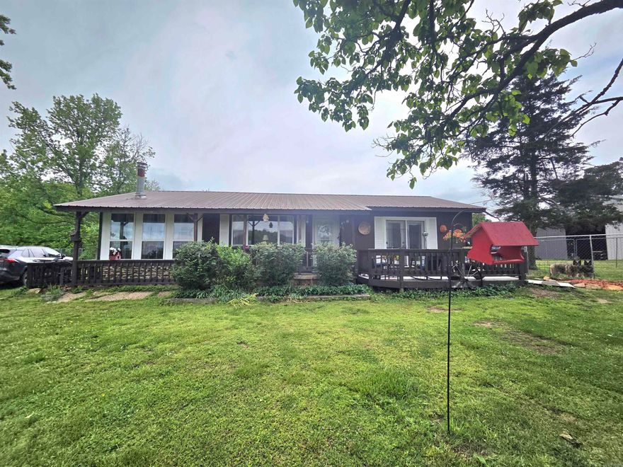 Welcome to the market this gem of a property. 40 beautiful acres and a well maintained 2 bedroom, 2 bathroom home with a deck on front and back, all electric with central heat and air, a fifth-wheel camper that sleeps six, all set up for visitors with it's own water, electric and septic system. A 50 x 40 shop to store all of your tools and toys in, with a 10 ft overhang to park equipment and more toys under. There is a spring fed pond that is stocked with fish for your enjoyment. There are several outbuildings that include a 4 stall horse barn, 2 hog houses, and another building that could be a chicken coop. There is a storm shelter. The grass on the property has been cut for hay each year and there are also mature trees scattered about the property. This is ready for you, your family and all of your animals! Make this your very own homestead.