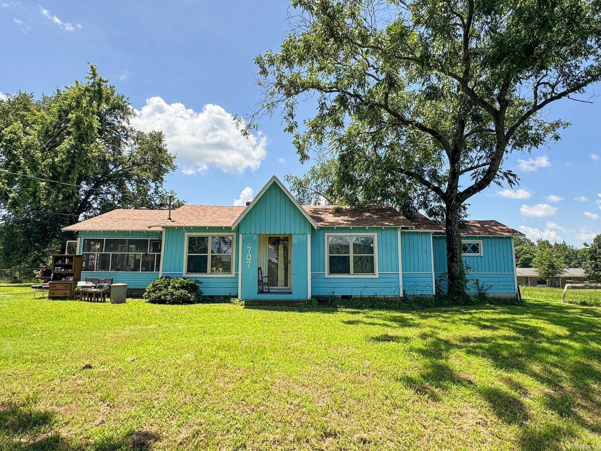 Spacious and full of Character! 3/4 Bedroom potential on large lot with Shop and Solar panels! Discover the perfect blend of space, charm, and convenience with this unique property located within city limits on 2 lots equaling about an acre of outdoor space. Inside you will find generous living spaces that reflect the homes personality with flexibility for home office, guest room, or play areas. Recent updates include a new roof and new hvac as well as solar panels all in 2024. Step outside to enjoy the expansive lots perfect for gardening, entertaining, or simply enjoying your own space in town. The outdoor shop offers extra storage or a perfect workshop for hobbies or business needs. Call for your showing today!
