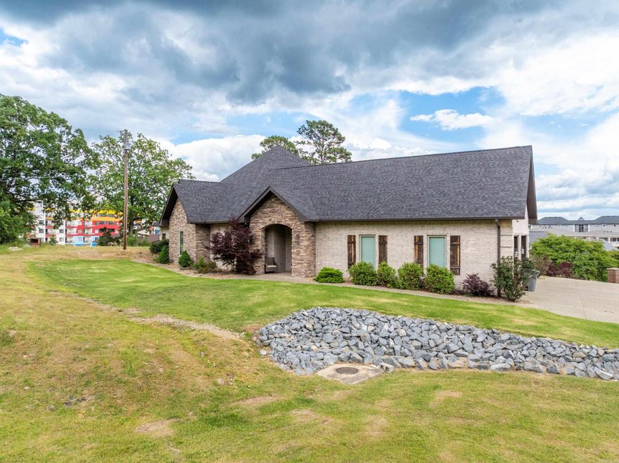 Custom-Built Luxury with Lake & Mountain Views in Hot Springs' Premier 7 South Location! Discover exceptional living in this meticulously crafted 4-bedroom, 4-bath custom home, built in 2017 with every detail in mind. Spanning 3,127 sq ft, this residence offers a perfect blend of comfort, style, and high-end features. Enjoy the spacious open-concept layout, highlighted by granite countertops throughout, foam insulation for energy efficiency, and a tankless hot water heater. The home features a zoned HVAC system for year-round comfort, and a fully irrigated yard with a sprinkler system to keep your landscaping pristine. Outdoors, entertain in style under the expansive covered patio, complete with a full outdoor kitchen and built-in fire pits—perfect for gathering with family and friends while taking in the stunning views of Lake Hamilton and the surrounding mountains. This property offers one of the best vantage points for enjoying the spectacular Lake Hamilton fireworks shows, right from your backyard. The oversized 3-car garage includes a dedicated car wash bay, ideal for car enthusiasts or anyone who values convenience.