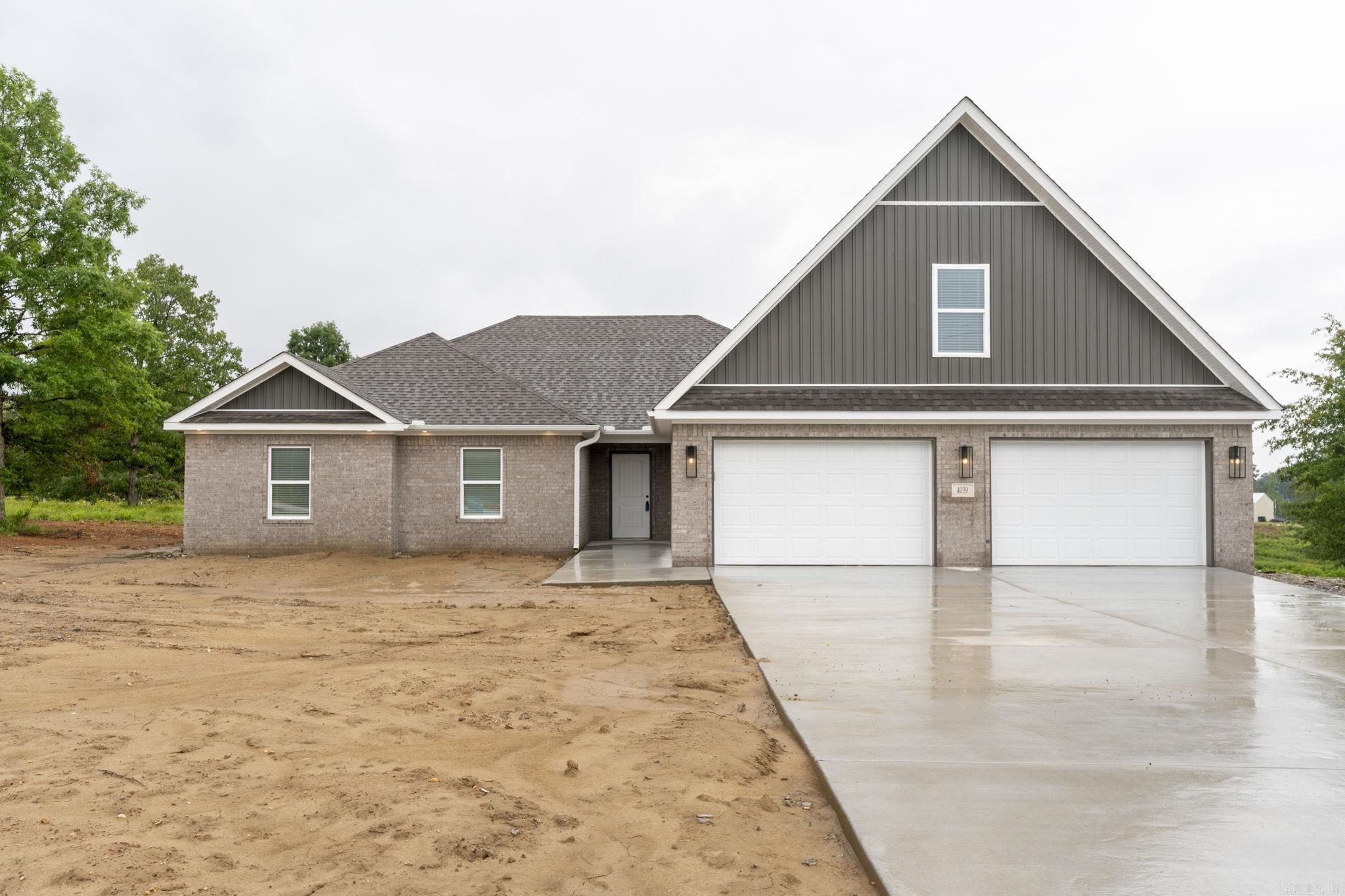 Brand New Home on a .96 acre lot! You'll love the open floor plan! **NO CARPET DOWNSTAIRS** Kitchen features custom cabinetry, full pantry, slab granite, and high quality stainless appliances. Great room has tray ceiling, wood burning fireplace and LVT flooring. **Wood blinds throughout**. The primary bedroom has a tray ceiling, jetted tub, separate shower and two closets with built ins (one is enormous). Very large covered back porch! 4th bdrm is upstairs and could also make a great game room! Laundry is large and has a sink. The garage is 32' wide with one side 24' deep, which is long enough for extended cab truck, fishing boat or utility trailer. The other side is 20 deep. Come check out this great home! Completely finished and ready for a new family.