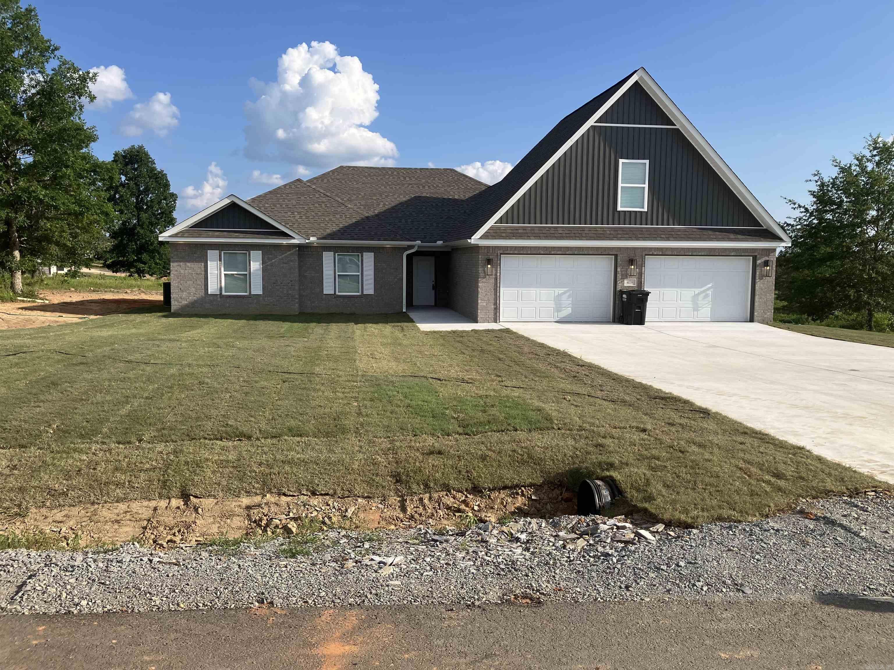 Brand New Home on a .96 acre lot! You'll love the open floor plan! **NO CARPET DOWNSTAIRS** Kitchen features custom cabinetry, full pantry, slab granite, and high quality stainless appliances. Great room has tray ceiling, wood burning fireplace and LVT flooring. **Wood blinds throughout**. The primary bedroom has a tray ceiling, jetted tub, separate shower and two closets with built ins (one is enormous). Very large covered back porch! 4th bdrm is upstairs and could also make a great game room! Laundry is large and has a sink. The garage is 32' wide with one side 24' deep, which is long enough for extended cab truck, fishing boat or utility trailer. The other side is 20 deep. Come check out this great home! Completely finished and ready for a new family.