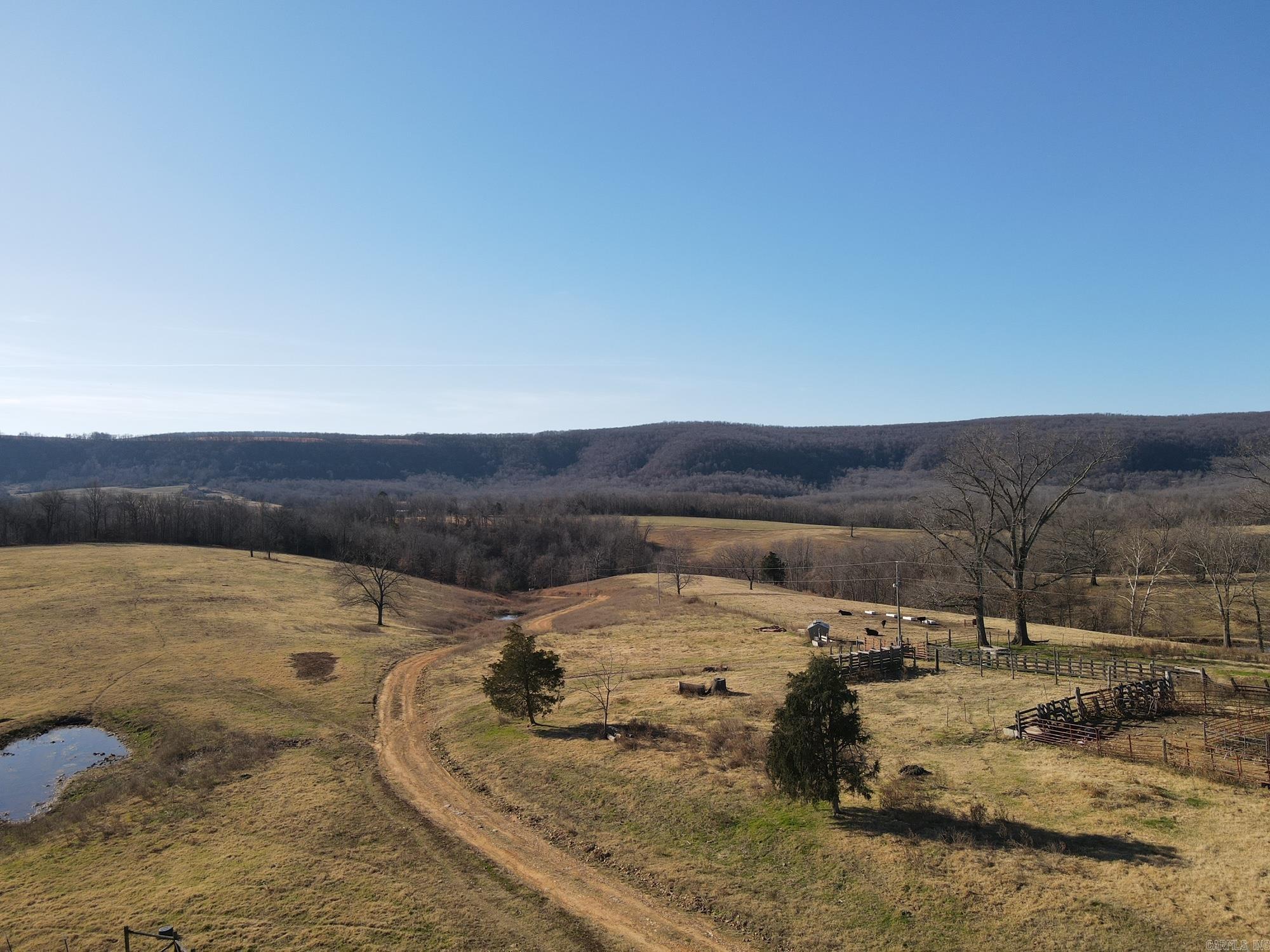 Rolling Mountain View cattle ranch with spectacular views all around. There isn't a spot on the property without a view of the surrounding country. Deer and turkey are plentiful in the rolling hills and draws. 10 ponds (some stocked) help supply water for cattle and/or horses in each of the pastures. Miles of good, tight fencing divide the property into multiple grazing and hay pastures. There is an extensive water system in place to provide water to multiple locations throughout. There are two hay barns, an insulated shop with electricity and an office as well as an equipment shed. This place is turn-key and ready for your livestock.