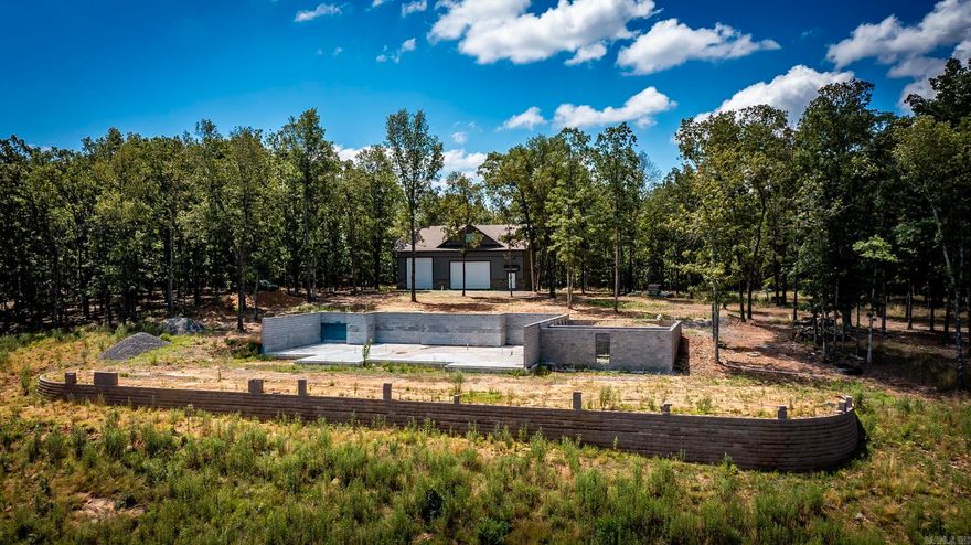 Let this property take your breath away!! This is one of those that you have to see in person to really appreciate how absolutely stunning it is. Diamond Bluff is known for its spectacular views and some of the most amazing lakefront and lake view homes. Have your own private sanctuary with the 10.45 acres this property has to offer. Privacy in a gated subdivision but not in the actual Cliffview Subdivision. Retaining wall in place and slab/blockwork has been completed for the start of your dream home. The completely heated and cooled 37x57 shop is perfect for staying on site while the construction of the home is being done. Shop has a half bath downstairs and the upstairs is plumbed for a full bath(has not been started) that could be a very nice living quarters/guest house. Septic and perc still will have to be done to the shop. RV garage door in a separated portion of shop and lean to on back. Plenty of places for all the toys. Very nice boat launch right down the road. Agents, please read ALL remarks.