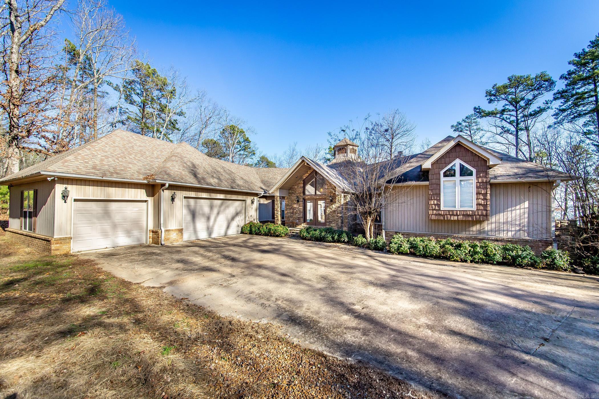 Welcome to your dream retreat—a stunning lakefront home in the exclusive Tannenbaum Community on the picturesque Greers Ferry Lake. This luxurious residence offers unparalleled amenities, including a deeded boat slip, making it a haven for those who love the water, golf, or even the thrill of flying in on your private aircraft. Inside, this spacious 4-bedroom, 4-bathroom home boasts an elegant blend of style & comfort. Two cozy fireplaces add warmth & charm to the interior, creating perfect spots to relax & unwind. The downstairs den is an ideal sanctuary for guests, providing privacy & comfort with its own cozy ambiance. This versatile space is perfect for hosting family & friends, offering them a home away from home. Step outside to discover an entertainer’s paradise. A beautifully designed firepit overlooks the tranquil lake, offering the perfect backdrop for evening gatherings under the stars. Whether you’re sipping wine with friends or enjoying a quiet moment by the fire, the lake's serene beauty will be your constant companion. Additionally, the property includes a large garage providing ample storage space & convenience, even a pet bath station. See agent remarks