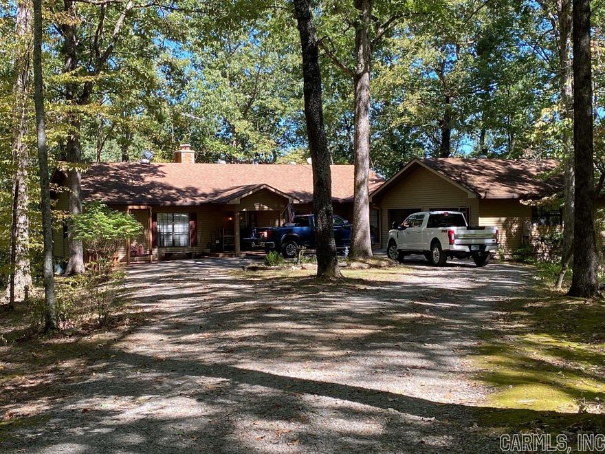Looking for a peaceful retreat with abundant wildlife within minutes of Lake Ouachita and Hot Springs? Nestled on 24 acres with the National Forest around this low maintenance home is perfect for those looking to escape the hustle and bustle of the city and enjoy the tranquility of nature. The main level features 2,023 sqft+/- with 2 bedrooms, 2.5 bathrooms, kitchen, pantry, living room, laundry room, and a two car garage. The partially finished 1,891 sqft+/- basement feature an additional 2 bedrooms, 1 bathroom, office area, snooker table, and much more. Feel the safety of or easily go off the grid with a backup generator, well water, wood induction heat, and a fireplace. 30' x 40' shop includes a small apartment and a lean-to.
