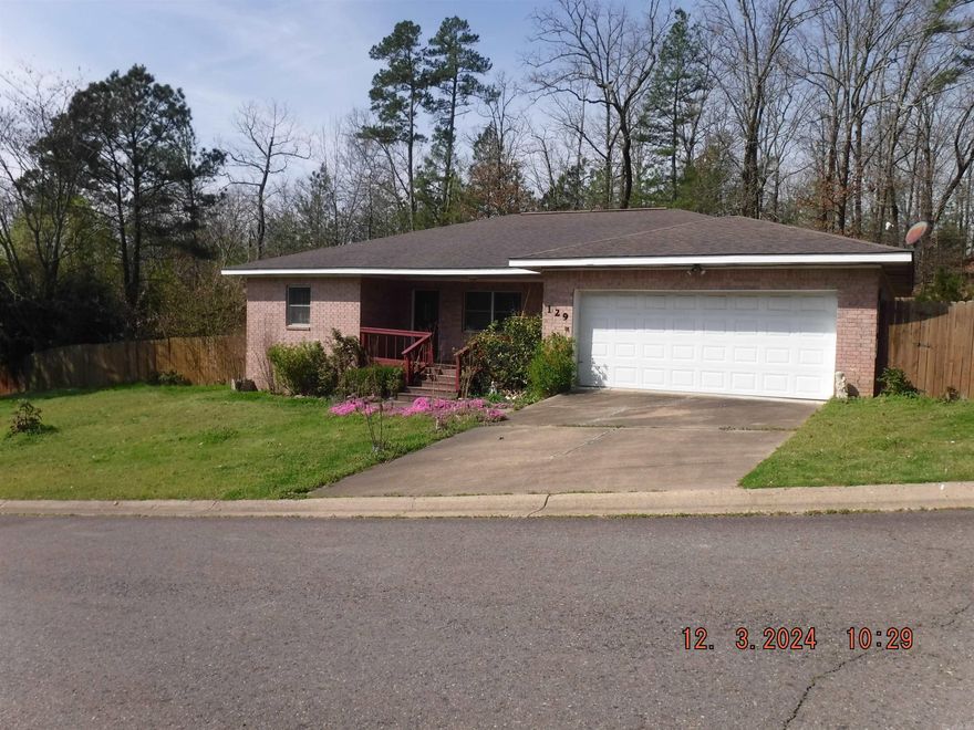 All brick home in Lake Hamilton SD. Sky Canyon Trl is a cul-de-sac street with very little through traffic. Just mins from Hwy 270W,Harps grocery store, and Wal-Mart. Convenient to NPCC, Lake Hamilton, dining. This one level home features 3 bedrooms. Two full bathrooms. Two car garage. Almost zero entry from garage into house. Fully fenced backyard with deck and storage building. Inside you have a semi open kitchen/living room/dining room spaces and a split floorplan with the master suite on one side and the additional two bedrooms and bath on the other. The kitchen has granite with stove, microwave, dishwasher, and refrigerator all conveying.