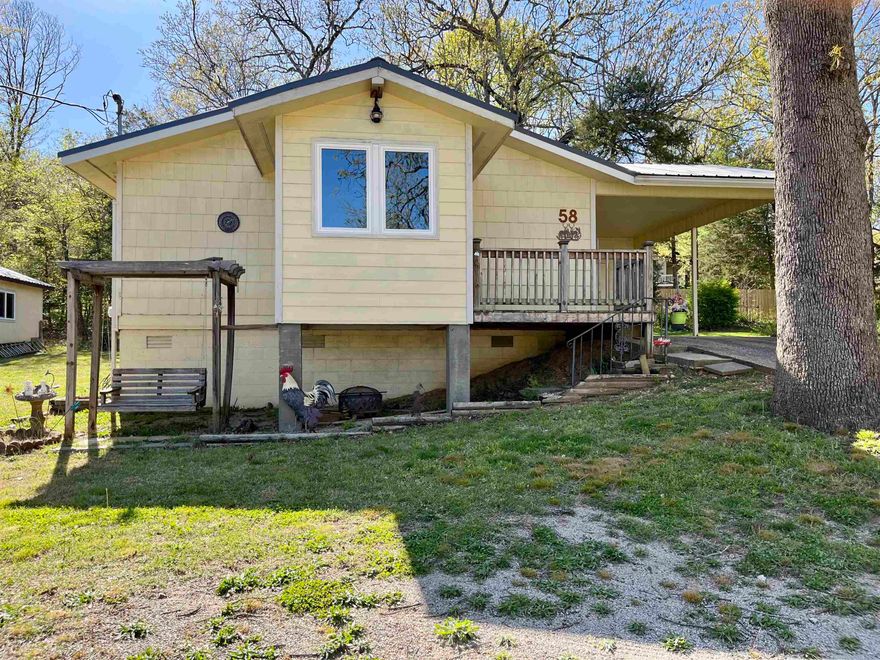 Don’t miss this charming 2-bedroom, 1.5-bath home across the street from the peaceful waters of Lake Thunderbird. This beautifully maintained property offers the perfect blend of comfort and charm, featuring a spacious living/dining combo ideal for both relaxing and entertaining.  Enjoy year-round lake views from the enclosed, heated and cooled sunroom, with gorgeous sliding barn doors that add a touch of rustic elegance. It’s the perfect spot for morning coffee or a cozy evening retreat. A covered carport with an attached storage area offers convenience and protection, while an additional shop building with electrical provides even more space for tools, equipment, or recreational gear. Whether you're seeking a peaceful weekend escape or a full-time residence, this inviting property offers a wonderful opportunity.