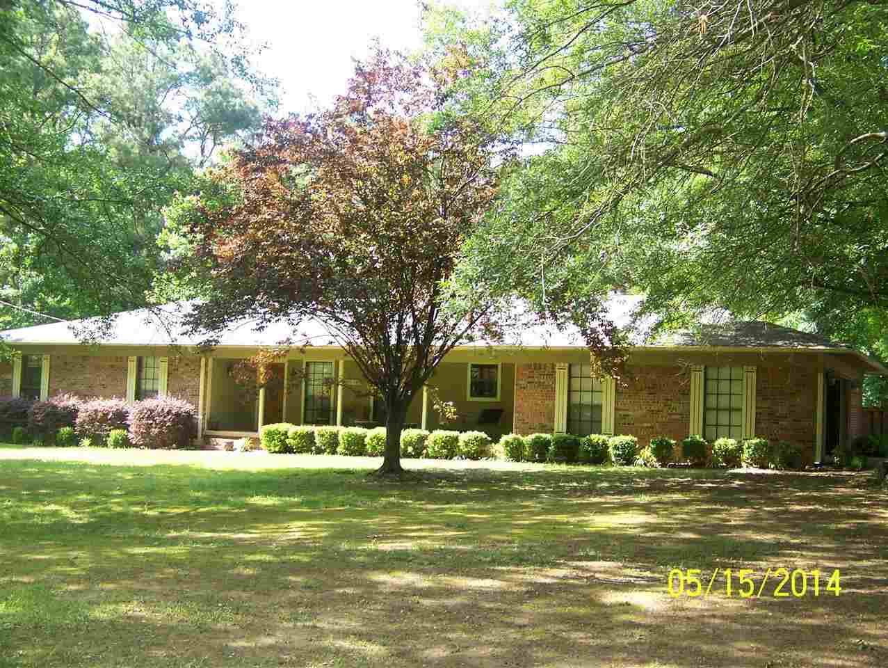 Peaceful country living yet close to everything!!!! Hardwood floors in the living room with a gas fireplace that can be converted back to wood burning. Kitchen with tons of cabinets. Large laundry and mud room. Double vanities and a separate tub in the master bath. Covered back patio. Decorative fish ponds. Outbuildings. Fenced area for a horse. Once you see the back yard you will be sold on this one. Please try and give at least an hour for showings to put pets up.