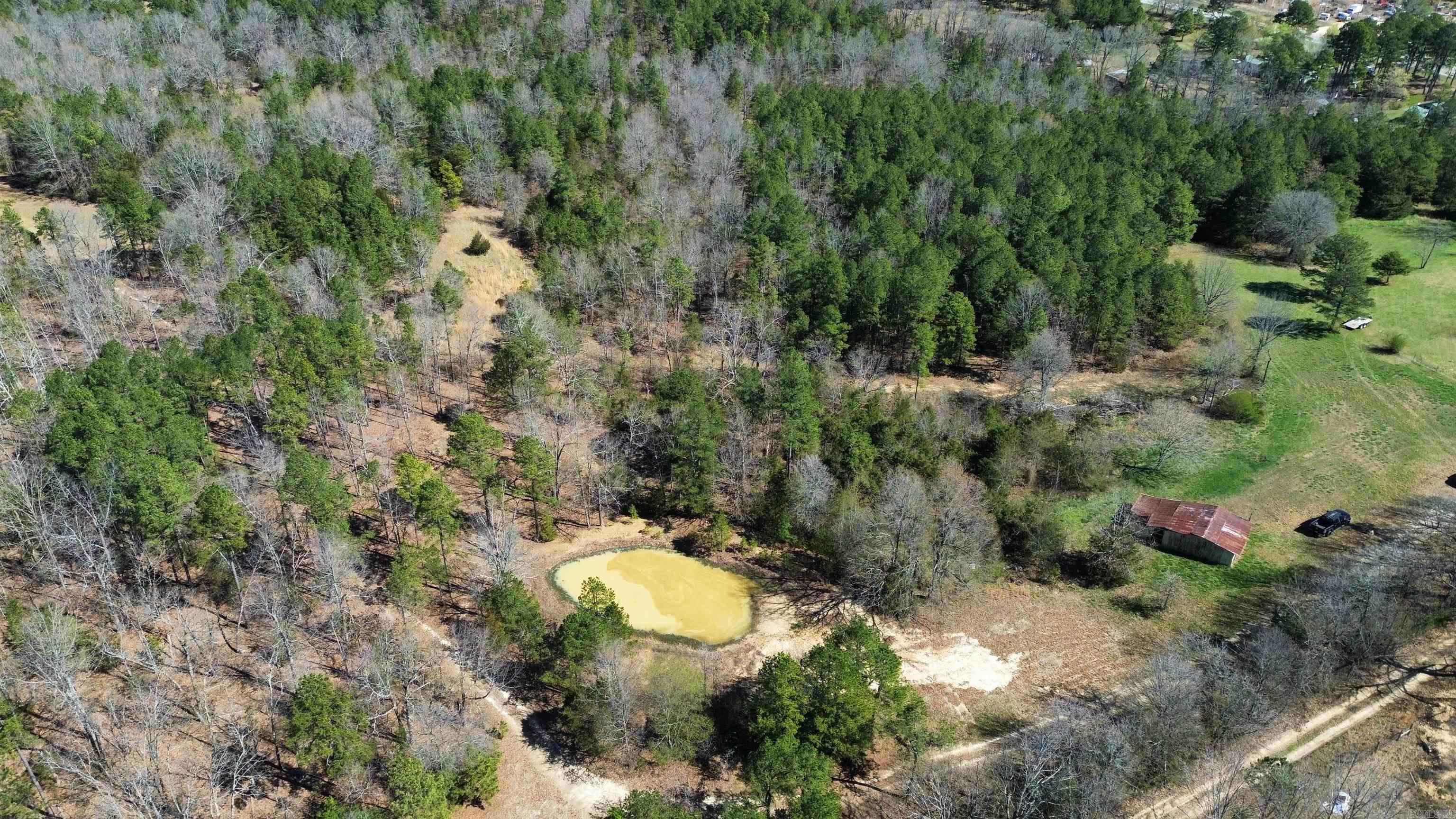 Nestled on 30.04 acres, this expansive property offers a picturesque blend of natural beauty and potential. Featuring a pond, diverse stretches of mixed pasture and timber, and abundant wildlife, it's an outdoor enthusiast's paradise and a hunter's dream. With no restrictions, the possibilities are endlessāwhether you're envisioning a peaceful homestead, a recreational haven, or a lucrative investment opportunity. Adding to its allure, an old barn stands. Plus, with electricity already available on-site, your vision for this landscape can easily come to life. Ready to escape the hustle and bustle and embrace the tranquility of country living? Don't miss out on this extraordinary opportunity. Listed for $99,900!