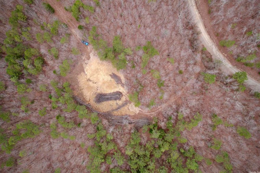 This wooded 9 acres is perfectly positioned at the National Forest Boundary away from the busiest part of the trails but definitely accessible to the forest.  Drive right off into the Forest with your ATV/UTV.  Mobile homes are allowed with a few restrictions.  Easy access to highway 71.  Newly surveyed acreage with complete privacy from the trees surrounding your new home place with a pad already in place,  the property continues uphill beyond the house pad. Electric is available near the pad and ready for your new home!