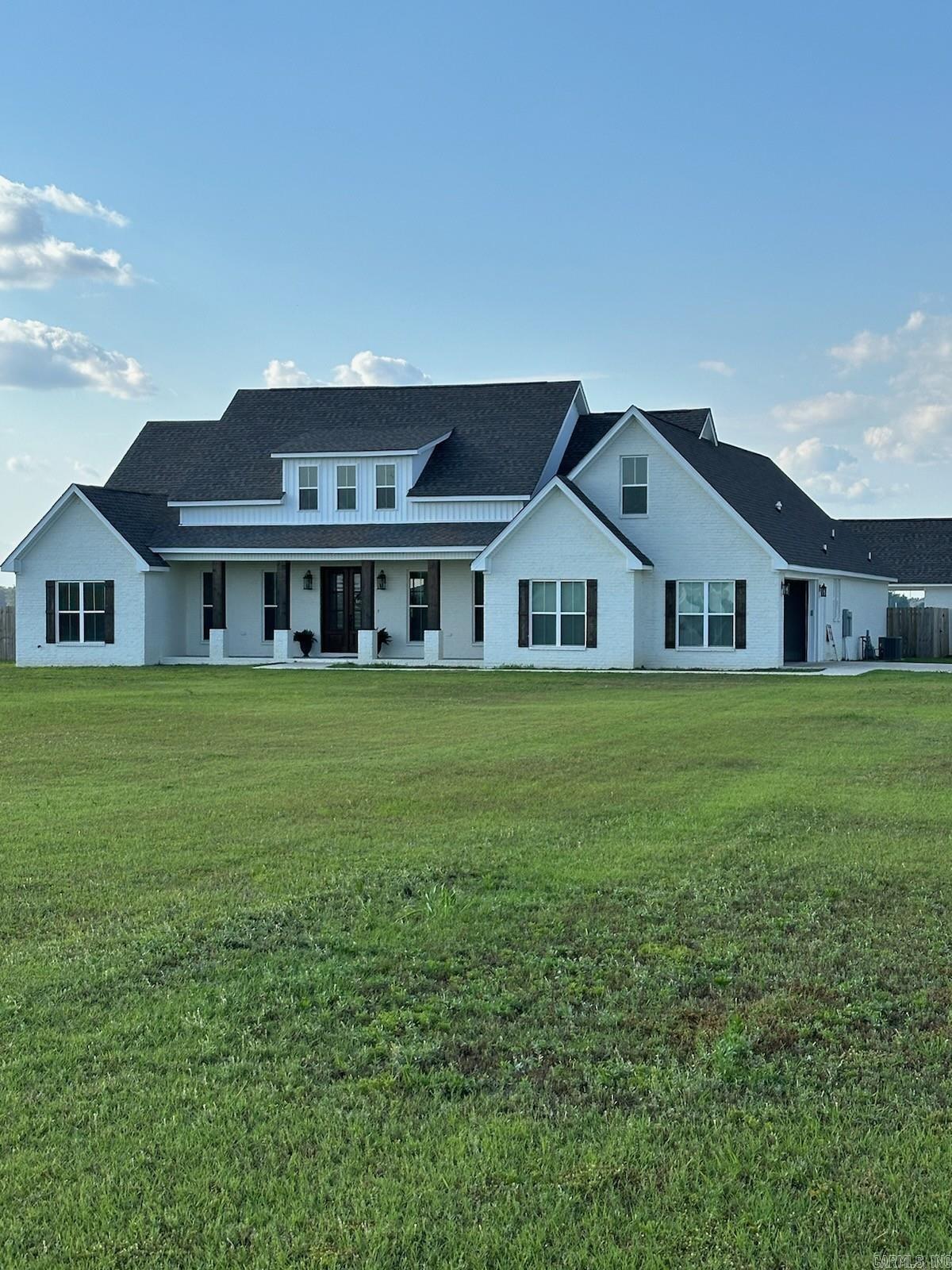 Beautiful custom 4 bedroom, 2.5 bath with a salt water inground pool, 30x50 shop, 20x20 gym on 6.15 acres in Manila. This gorgeous home offers vaulted ceilings in the living room with a fireplace that over looks the amazing kitchen, with a ice maker, double oven and lots of cabinets. The master suite offers a huge tiled tub and show with rain drop shower head. The laundry room is large and has a dog shower. These are just a few of the many features this home has to offer.