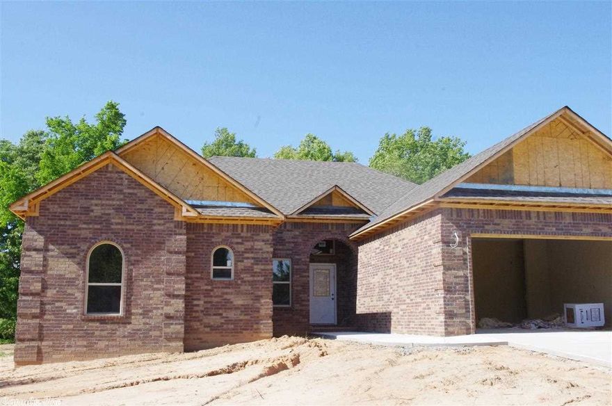 New 4 Bedroom 2 Bath all Brick home. 23'X17' Living Room with Double Pan Ceiling Recessed lighting W/ Hand Scraped Hardwood floors. Master Suite is spacious 16'X16' Room and Jetted Tub Sep/Shower and Double Vanity. Kitchen is open to living area Features are Custom Built Maple Cabinets Stainless Appliances and Pantry. Breakfast Bar and 12'X12' Dining area. Off of the Dining area is a 12'X12' Covered Patio. Property is a short distance from I-40 A MUST SEE!! Approx. Completion Date January 2014