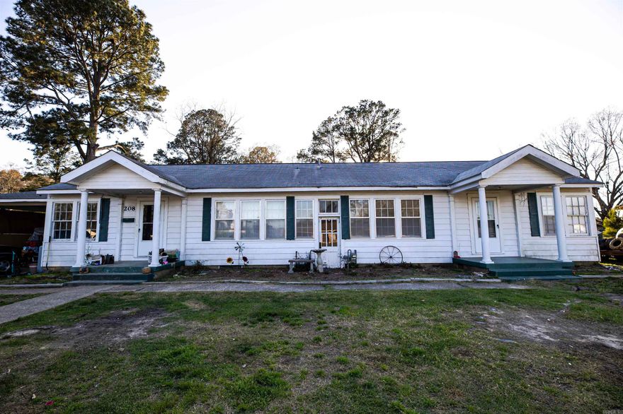 Harmony Grove -- a unique find as a large single family residence, or some minor modifications to components still available to convert back to a duplex!  Each bedroom offers generous space, with the 5th currently used as a large laundry/craft room.  The double carport offers a small under-roof storage room, and the fully fenced yard provides space for pets, privacy, and hobbies.  Brand new HVAC system installed in January 2026 as a head start to making this one a comfortable place for you to call home!