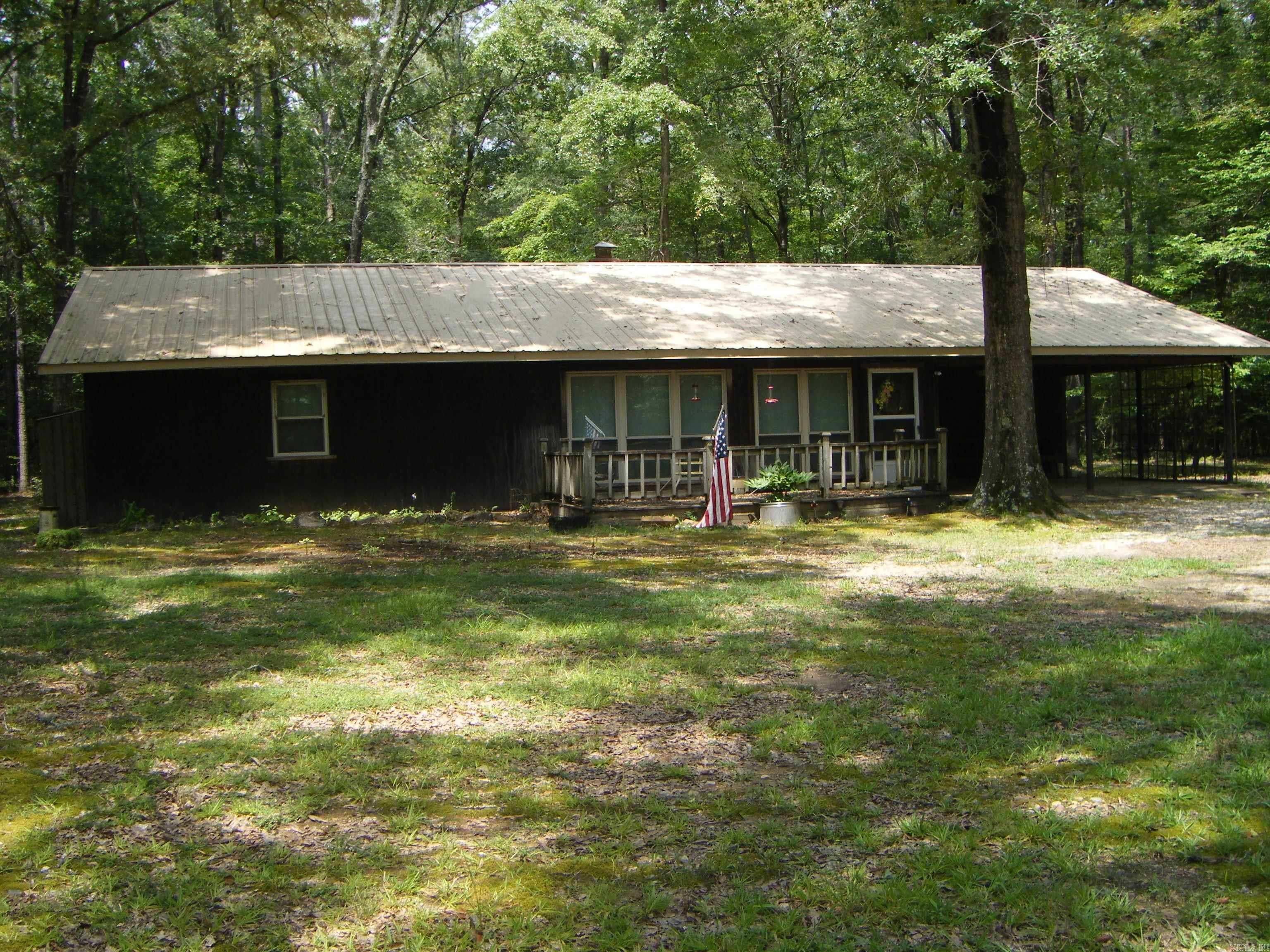 PRIVATE, PEACEFUL, PERFECT for COUNTRY LIVING with all the Amenities! If you are looking for a place to relax, unwind, and unplug this it it! Plenty of room to spread out on this spacious 20.00 Acres of gorgeous hardwoods complete with 3 BR, 2 BA home, metal roof, boasting 1988 sq ft. The house has been well maintained. Kitchen/Dining Combo, Living Room, with Sunroom and porch off the back. Brick wall set up and plumed to add wood burning stove or Pellet stove in both LR and Kitchen. Need a place to work on projects or store your atv or boat- the 30x50 shop with concrete floor, work benches, 2 rolls up doors and lean-to on the side will come in handy. Stocked Pond, Smoke house, fenced in garden spot, PLUS- an artesian well with the best tasting water around that's been overflowing since the day it was dug. Would also make a great family hunting retreat. Lots of Deer, Squirrel, and Turkey. Call today to see this special, one-of-a-kind place.