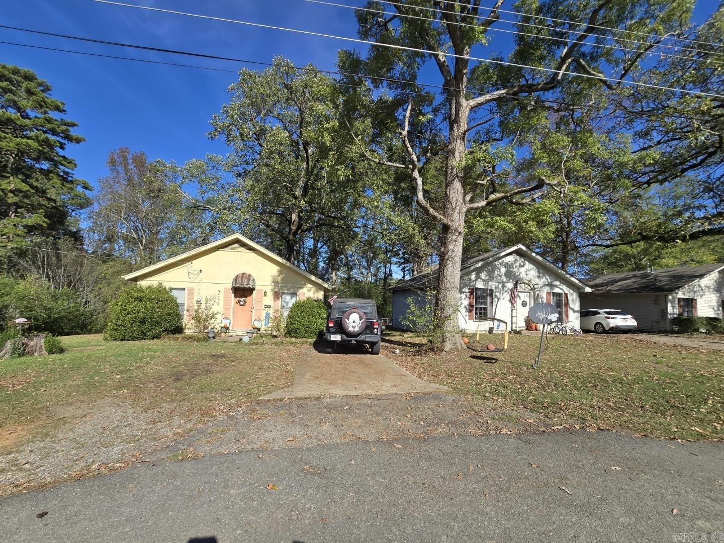 Three lovely homes, each two bedroom one bath.  Nice neighborhood, convenient to all schools.  So many possibilities with this property!