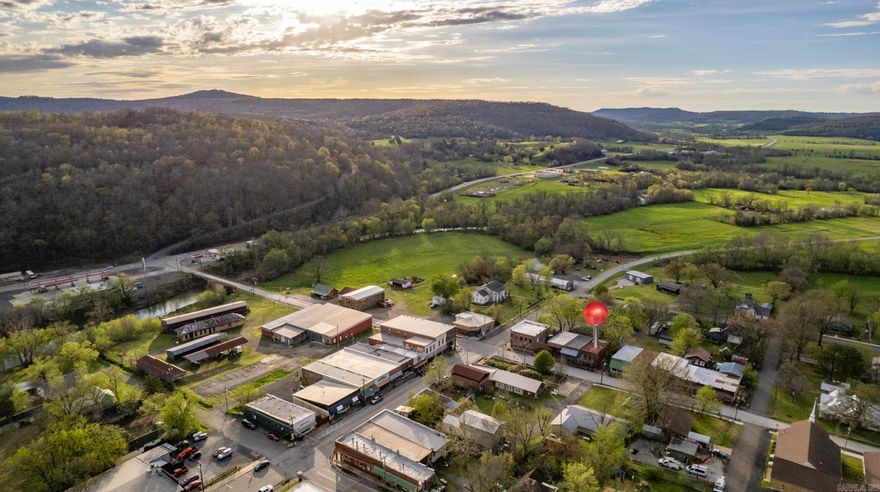 You don't want to miss this one. Located in the heart of downtown Leslie, this historic building offers incredible flexibility use it as a residence, a commercial space or a blend of both. The property is withir walking distance of shops and restaurants. It is located approximately 18.1 miles from the Buffalo National River. The current owners have created the storefront into a move-in ready space, accompanied by a vood stove. The rest of the structure is ready for customization to fit your needs! High speed internet is available within the city! Please see video tour! PLEASE VERIFY SQUARE FOOTAGE Agents see remarks