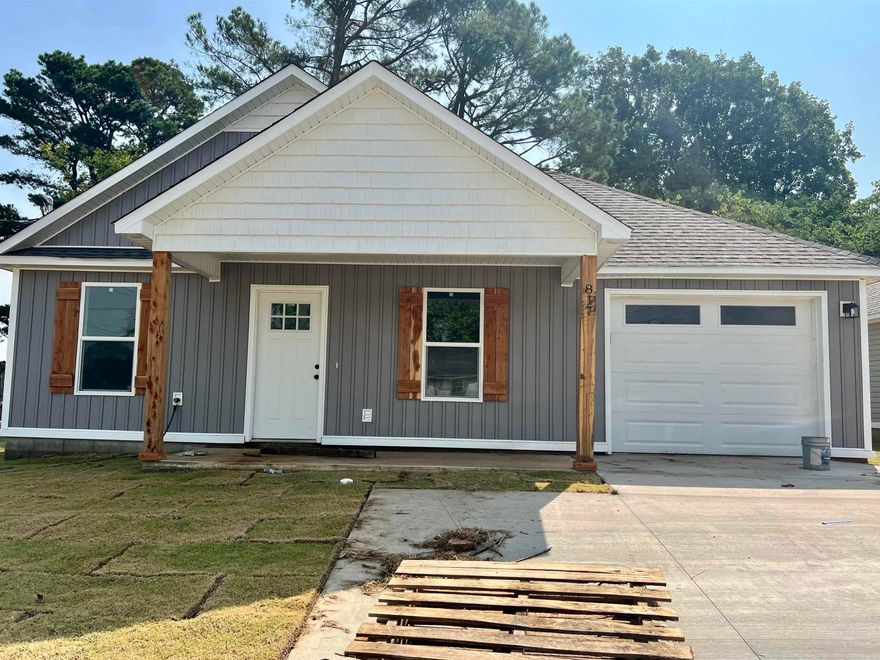 New construction! From the welcoming front porch, be invited into the house through the open kitchen/dining/living areas. Down the hallway is the guest bathroom, laundry closet, and three bedrooms. The primary bedroom also contains an ensuite bath. Kitchen and baths feature custom cabinetry. This beautiful house has a one car garage with an extra parking pad, and the back side of the garage features a concrete patio. Call to check it out today! (Annual taxes amount includes lot only.) Construction is complete!