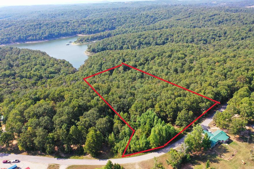 10.28 AC m/l Estate Lot bordering Corps land on Lake Norfork. A nature lovers dream with abundant wildlife to include deer ,turkey, eagles, and more. Domestic water line, sized for fire protection, available in roadway. High speed internet available. Property has had preliminary soil testing for septic system. Paved county road frontage which dead ends at lake. Lots sit well above lake, and well above the Corps flood zone. Protective covenants in place. Possible lake view with some clearing. Less than 10 minutes to Tracy Marina; 15 minutes to downtown Mountain Home.