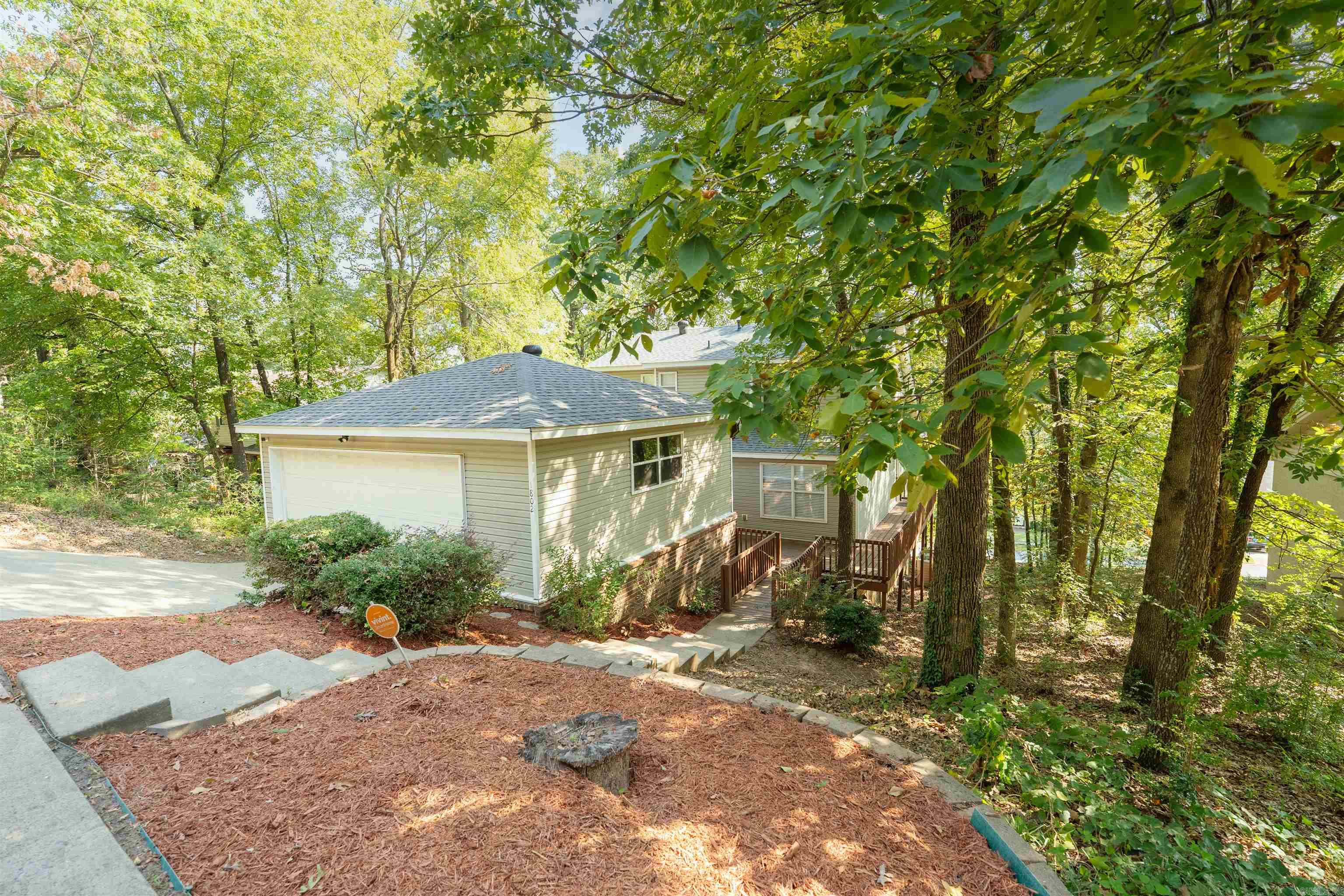 Just a 10 minute walk from Pulaski Academy, this convenient home offers tons of space, and tons of opportunities for great memories Take the front door into your kitchen, complete with an island, dishwasher, stove, & fridge that can stay Walk past your dining area to enter the living room, featuring a fireplace, side exit, and access to your balcony, can you imagine cooking some steaks out here? We’ll stop imagining because this grill comes with the home Head down the hall to guest bedroom #1, spacious with ample closet space & a bathroom right next door Upstairs you have two more guest rooms, along with a Jack and Jill style bathroom Downstairs you have your owners suite, complete with an oversized closet, & your private bathroom suite. Featuring a walk in shower with a sliding glass door, and a water closet Make sure to check out the deck on your way out. 1802 Jennifer drive, welcome home