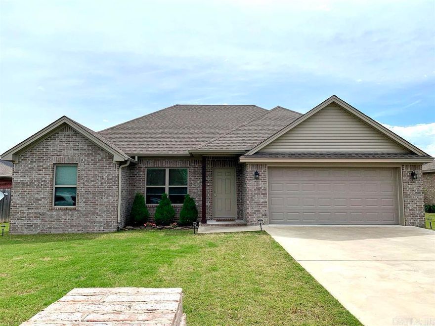 This well-designed layout features a split bedroom floor plan, providing privacy with the master suite on one side and two additional bedrooms on the other.