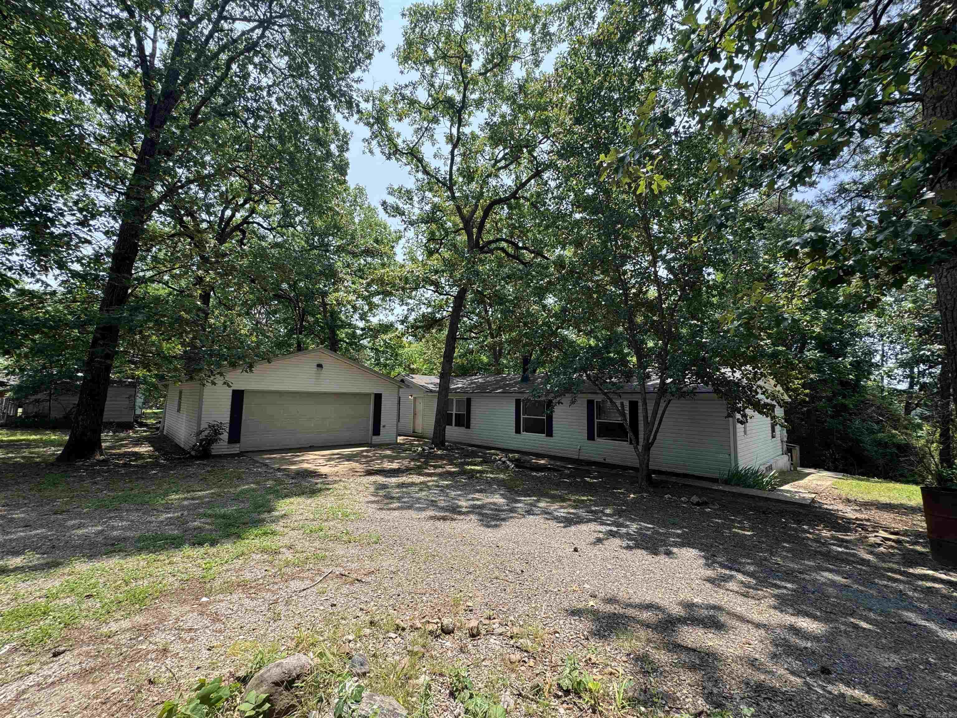 Investors take notice. Double wide with a built 2 car garage. Lot was split last year, see survey attached. Good rental history. House needs some work.