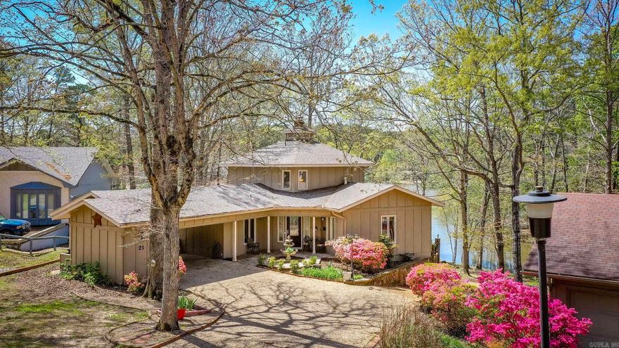Welcome to your lakeside retreat on beautiful Lake Segovia! This 3-bedroom, 3-bath home offers 2,035 square feet of thoughtfully designed space, where every bedroom has its own private bathroom—ideal for comfort and privacy. There is a 3rd bedroom upstairs that would also make an excellent game room, informal living room or office space.   Enjoy peace of mind with major updates already done for you: a new roof in 2021, two new HVAC units in 2023, a new water heater, updated plumbing, and an ADT security system. The kitchen has been refreshed with brand-new appliances and flooring as well as new flooring in the master suite and sunroom! Call/text to schedule your private tour today and feel free to check out our interactive virtual tour as well.