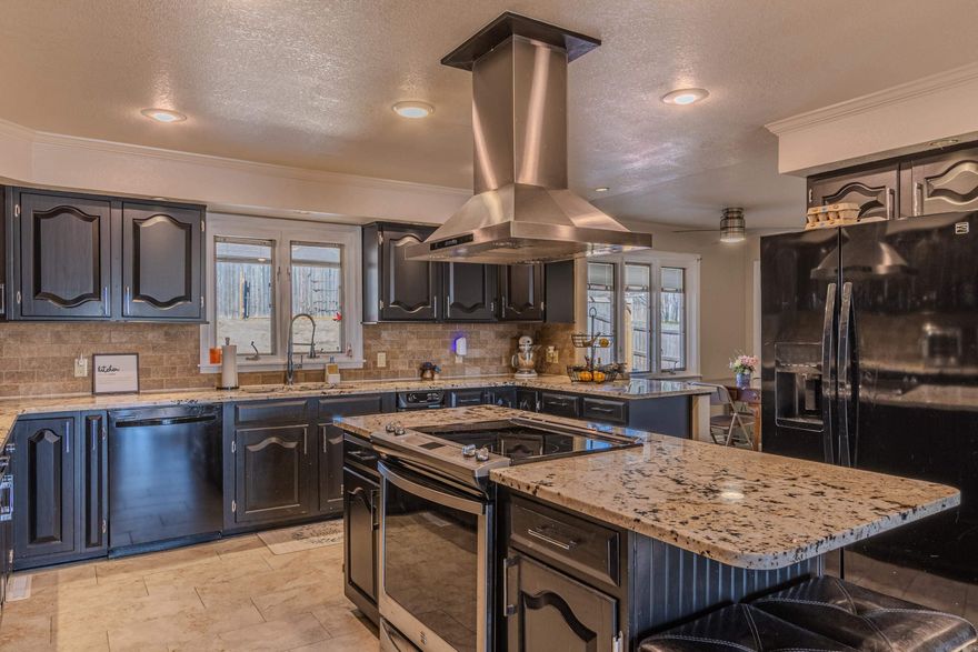 Tucked away at the end of a quiet cul-de-sac, this impressive 2,883 sq ft home offers space, privacy, and timeless character on a generous 0.47-acre lot. Featuring 4 spacious bedrooms and 3.5 bathrooms, the home has been thoughtfully updated with walk-in showers and a private en suite for added comfort. The inviting den showcases a cozy fireplace accented by beautiful wood beams, while the sunroom with a wood-paneled ceiling provides a warm, relaxing space to enjoy year-round. The massive kitchen is ideal for entertaining, offering granite countertops, ample cabinetry, and easy flow into the dining room. Fresh paint in select areas adds a clean, refreshed feel. With its blend of updates, charm, and peaceful setting, this property is perfect for those seeking both comfort and privacy.