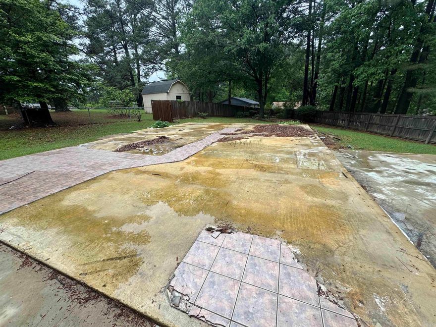 Very nice lot with shade trees and existing fence.  There is a concrete slab from the previous home.