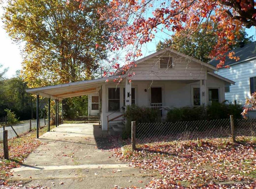 Affordable one level stucco ranch style home conveniently located within the city of Hot Springs. Home features: 2 bedrooms, 1 bathroom, living room, kitchen, spacious den, front open porch, attached 1 car carport and outside storage building. HUD Case #031-318935, FHA Financing: IE (Insured Escrow), Property is sold in as is condition, no warranties, guarantees or representations about the property. (See agent remarks for more information.)