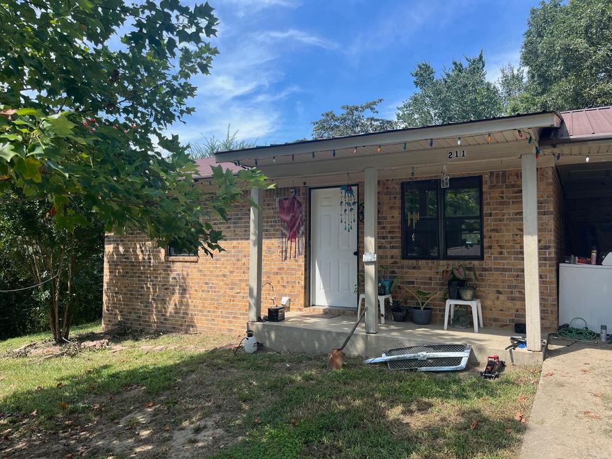 1993 brick Home , 2 bedroom, 1 bath, Carport, needing a little TLC.  This Home sits on a corner Lot & 1/2.