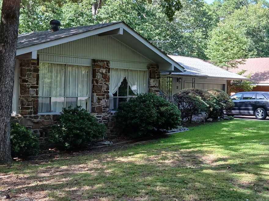 Discover the potential in this spacious 3 bedroom, 3 bath home perfectly situated on Hole 18 on the DeSoto Golf Course in Hot Springs Village (HSV), the largest gated community in the United States. Open living ad dining room off of the kitchen makes this layout perfect for entertaining! This property features a basement complete with a cozy family room and fireplace. There is a bar and full bath off of the family room. The storage downstairs is amazing! Watch the golfers go by on the screened-in back porch.  Hot Springs Village offers an unmatched lifestyle with nine golf courses, 11 recreational lakes, miles of walking and biking trails, fitness centers, swimming pools, tennis and pickle-ball courts, and community clubs and events for every interest. With 24/7 security and all the conveniences of a well-planned community, HSV combines resort-style living with everyday comfort.  This home is ready for your personal touch to make it truly yours—whether you’re looking for a full-time residence, vacation retreat, or investment opportunity. Showings require 24 hours notice.