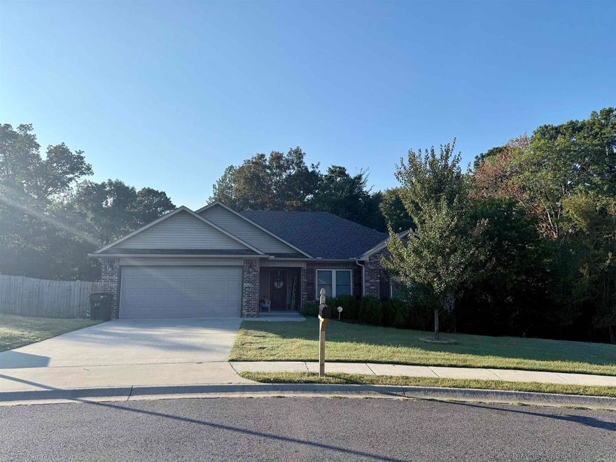 BEAUTIFUL HOME IN HAMILTON PARK SUBDIVISION! This home was built in 2018 with 1,417 sq. ft. One Owner Home. Corner lot with one of the largest backyards in the subdivision. It boasts an open floor plan with the living room featuring a wood burning fireplace with 10' ceiling, hardwood flooring all throughout, wooden blinds, and ceiling fans. Breakfast bar in the kitchen, dark brown cabinets topped with exotic granite counters, can lights in kitchen, large tile flooring, and stainless steel appliances. Exotic granite counters and tile flooring continued in both bathrooms. Two separate walk-in closets in master bathroom. Jacuzzi tub with shower combo in master bath. Linen closet in both bathrooms. Split floor plan. Spacious bedrooms with 8’ ceilings. Covered back deck and fenced in yard. Crawlspace storage. Custom shutters. New roof, gutters, and new Alaskan windows (July of 2023). New steel piers added by a licensed professional (September of 2025). Lake Hamilton School District.