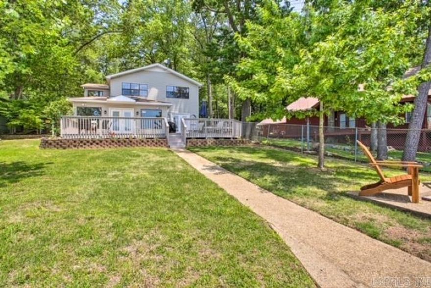 **Stunning Lakefront Home on Lake Hamilton!**  Welcome to your dream retreat! This beautifully renovated four-bedroom lakefront home offers a perfect blend of comfort and adventure. Boasting breathtaking views of Lake Hamilton from the spacious kitchen, open living room, and large bedrooms.  this property features a large master suite complete with a luxurious walk-in shower and soaking tub. An additional game room currently serves as a cozy bunk room, ideal for hosting friends and family.      Enjoy outdoor living at its finest with a beautiful backyard perfect for games or relaxation, along with a fantastic back porch and patio area for entertaining. The community boat dock and scenic park are just a block away, providing easy access to the water, along with private parking and picnic tables for your enjoyment.     Located just minutes from Hot Springs yet nestled in the tranquility of the county, this home is currently a successful vacation rental, offering great income potential for the new owner. With granite countertops throughout and excellent lake access, this property is a true gem! Don’t miss your chance to own this slice of paradise!