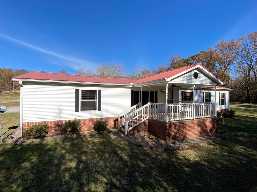 This private 5 acre culdasac property is a few miles west of Searcy's city limits. High quality 28x70 Dutch Manufactured Home. 24x30 carport on concrete joins the home with a covered walkway. The 12x14 covered concrete front porch overlooks a small pond. This home has three very spacious bedrooms with walk-in closets in each, two full bathrooms, and a custom built walk-in tiled shower in the master. Bar seating in the kitchen, quartz countertops, and mobile island. Brick underpinning on a permanent foundation. 30x50 fully insulated red iron steel shop building with 16' ceilings on a concrete foundation. The shop is wired with 220 service equipped for any work. 250 gallon propane tank, entire shop air system, and 60 gallon standing air compressor conveys. 12' garage door at each end, one of which is automated. 19x30 red iron/metal building with 12' garage door, 20x20 galvanized steel structure with concrete foundation, and 32x14 Morgan building with vaulted ceiling. 6 person storm shelter. All appliances convey. Brand new 4 ton Train heat pump and 4 ton electric furnace to be installed with full homeowner warranty. The property benefits from Searcy city water and Entergy electric.