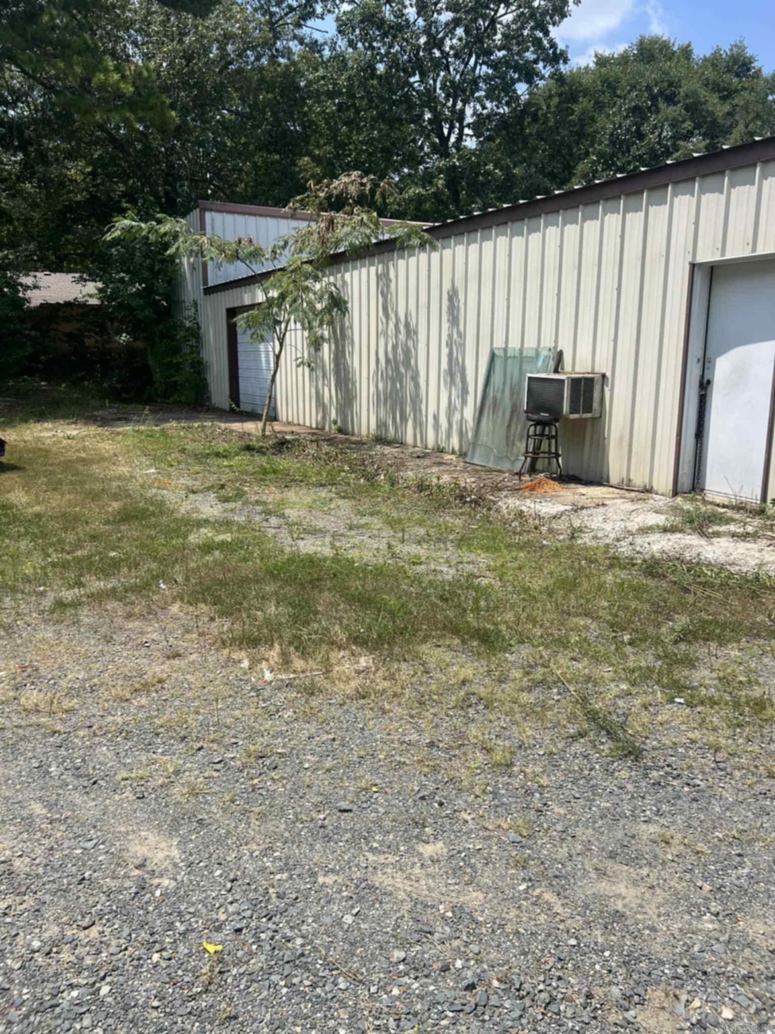 Highway 4 Frontage, 2 acres and a huge metal drive-thru shop!! 2800 square feet for storing your side by sides to ride all the National Forest Trails. This property has been appraised and is priced to sell! There is a large Pond with beautiful flowers in front and the super large shop in the middle, multiple large carports for storage in the rear. The older mobile home has a roof over the entire structure with a covered porch area, it conveys at no value (no title). Half a mile to Scotty's. This won't last long!!
